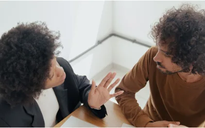 An owner and a consultant reviewing a plan together
